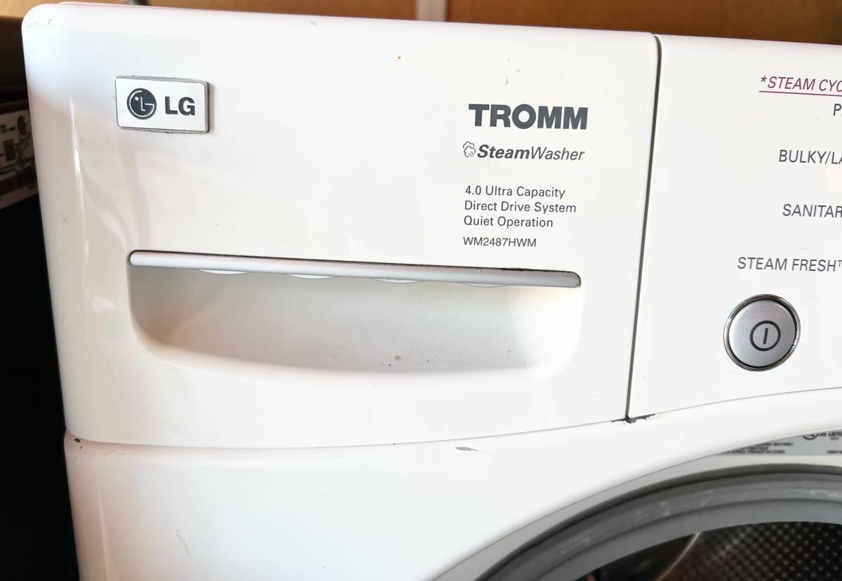 27 INCH LG WM2487HWM TROMM Front Load Washer 4.0 cu. ft. White , Used Condition , 1200 RPM . Direct Drive , Ultra Capacity , Never Rust Stainless Drum , HE , Roller Jets , 9 Washing Programs, 5 Temp Level,Remote Monitor,Stackable,LED,Chrome Rimmer Door
